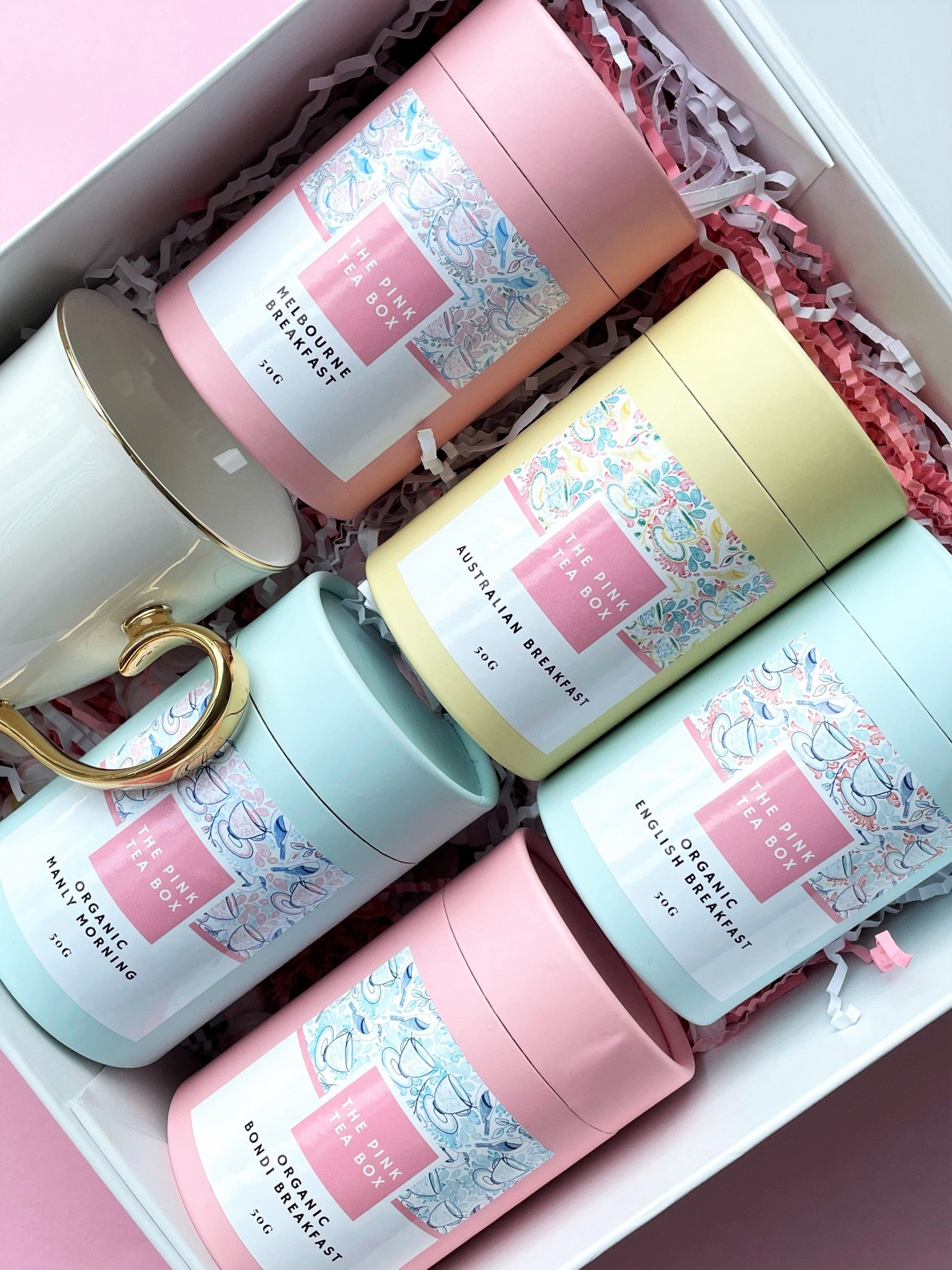Selection of pretty tea canisters containing various teas from the pink tea box
