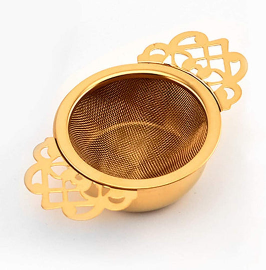 Our  Gold Tea strainer is the perfect gift for any tea lover.  If you enjoy the ceremony of afternoon tea, you will want to use all the right accessories. This twin handled, gold plated tea strainer in the Empress style, with drip bowl is the perfect accessory for an elegant afternoon tea.